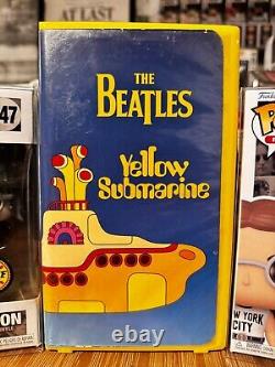 JOHN LENNON in Peacoat CHASE & NYCC FUNKO POPS & WORKING YELLOW SUBMARINE VHS